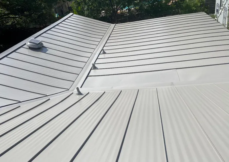 Solar attic fan installed on a metal roof for Roof Ventilation in Arden Hills